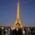 Samuel Bhella with the Eiffel Tower in the background